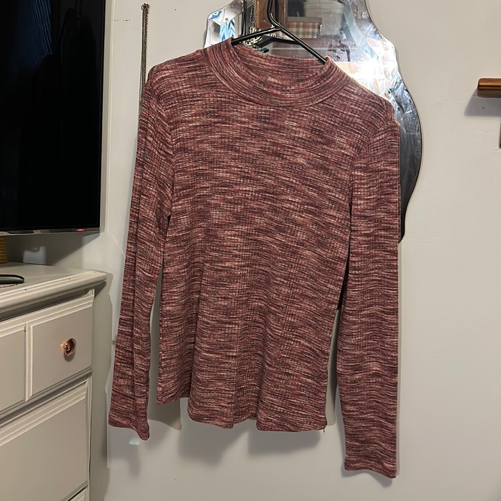 Maurice’s pink turtleneck